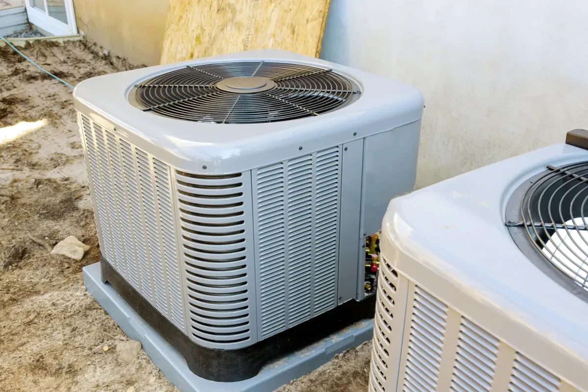Two outdoor air conditioner condensers