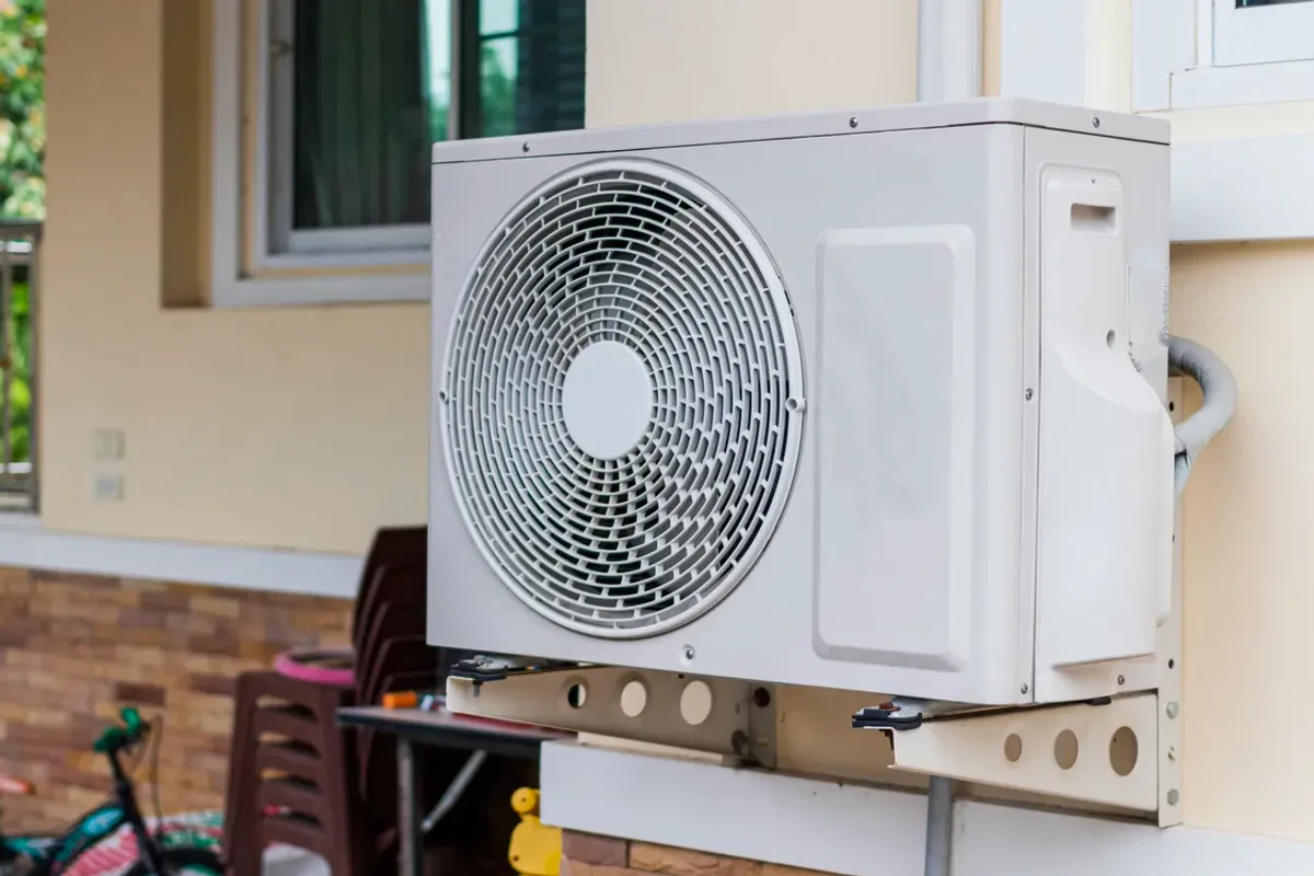 Outdoor heat pump unit on a wall bracket